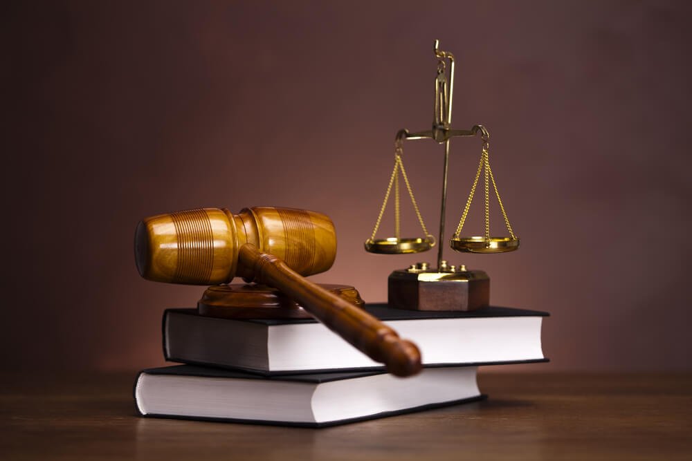 Gavel and scales resting on law books