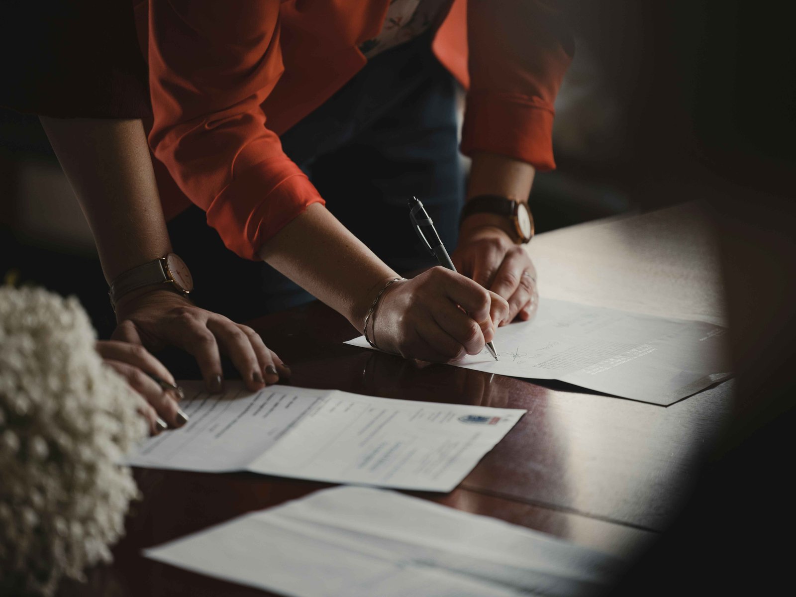 Two parties discussing and signing an agreement
